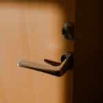 brown wooden door lever