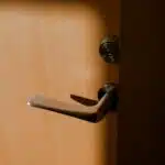 brown wooden door lever