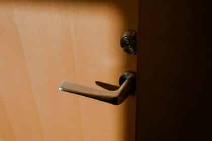 brown wooden door lever